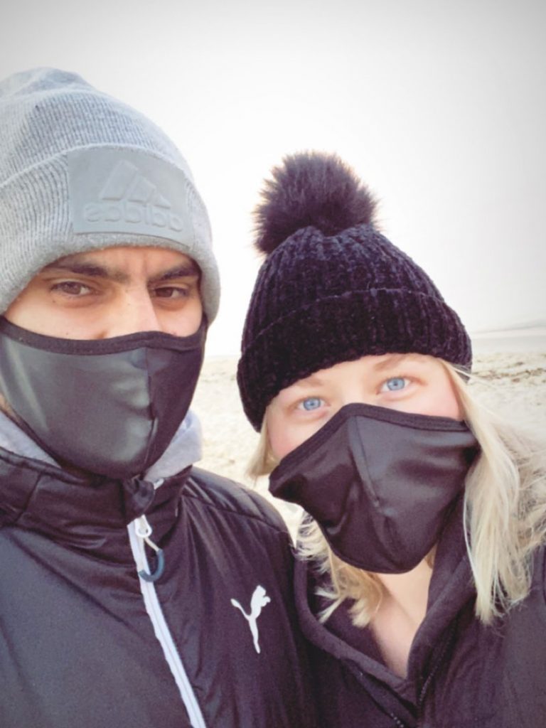 couple wearing face masks outdoors