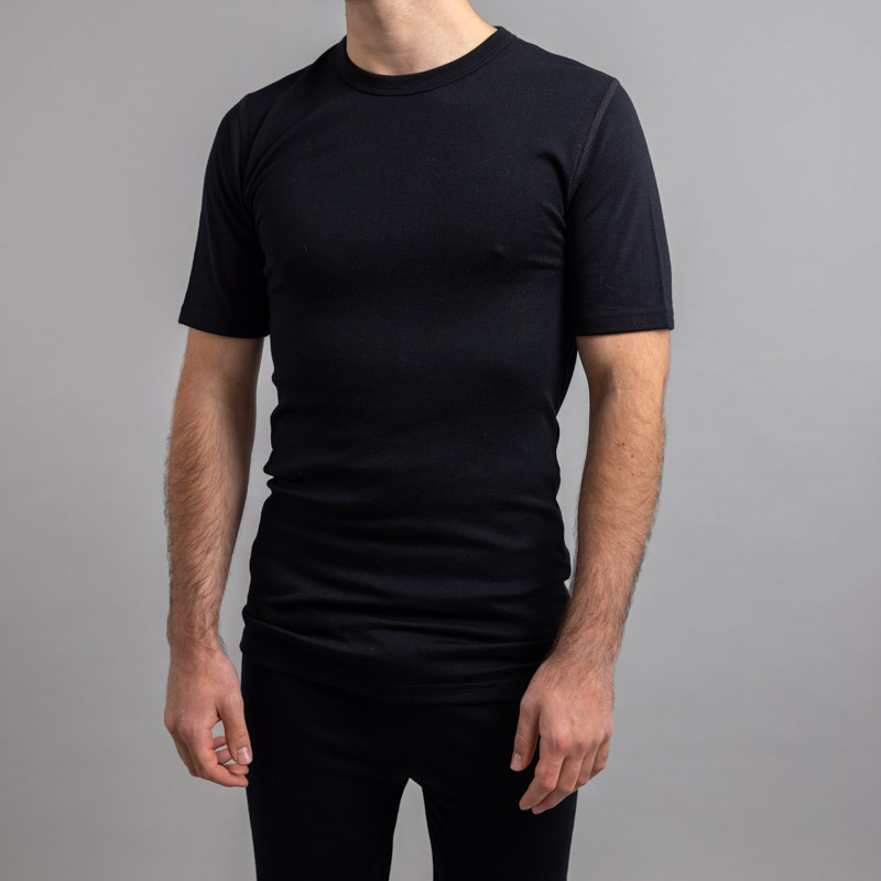 Front view of a male wearing black Merino Skins – Unisex Short Sleeve Crew Neck