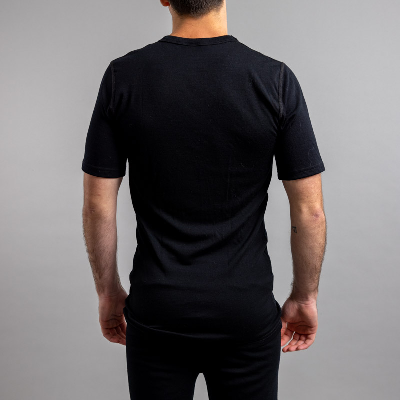 Rearview of a male wearing black Merino Skins – Unisex Short Sleeve Crew Neck