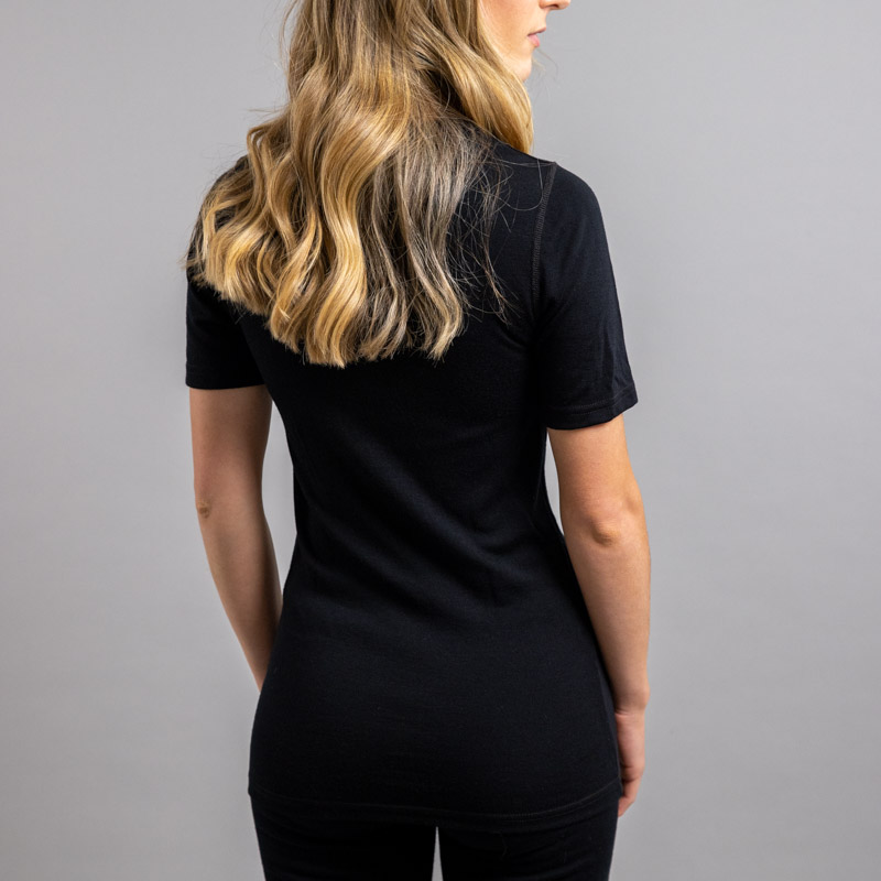 Rearview of a female wearing black Merino Skins – Unisex Short Sleeve Crew Neck