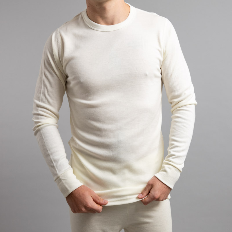 Front view of a male wearing white Merino Skins – Unisex Long Sleeve Crew Neck