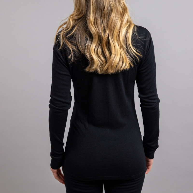 Rearview of a female wearing black Merino Skins – Unisex Long Sleeve Crew Neck