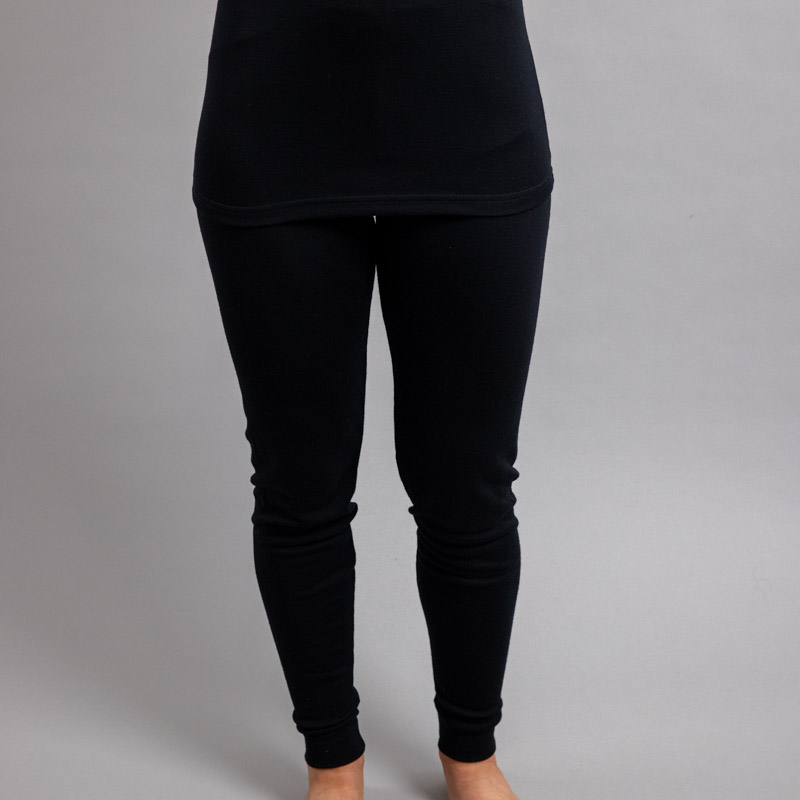 Front view of a female wearing black Merino Skins - Unisex Long John / Pant