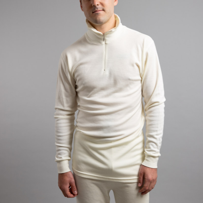 Front view of a male wearing white Merino Skins – Unisex Long Sleeve Half Zip Front
