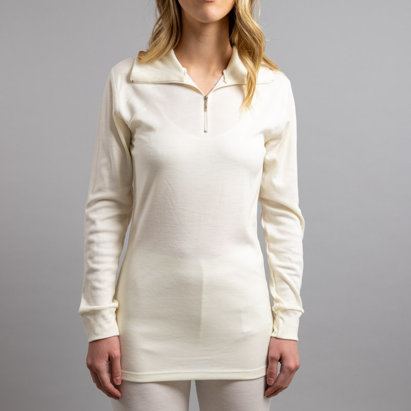 Front view of a female wearing white Merino Skins – Unisex Long Sleeve Half Zip Front