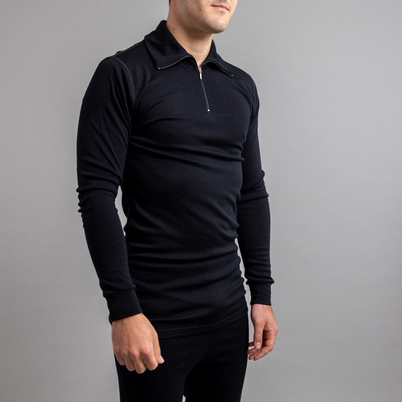 Front side view of a male wearing black Merino Skins – Unisex Long Sleeve Half Zip Front