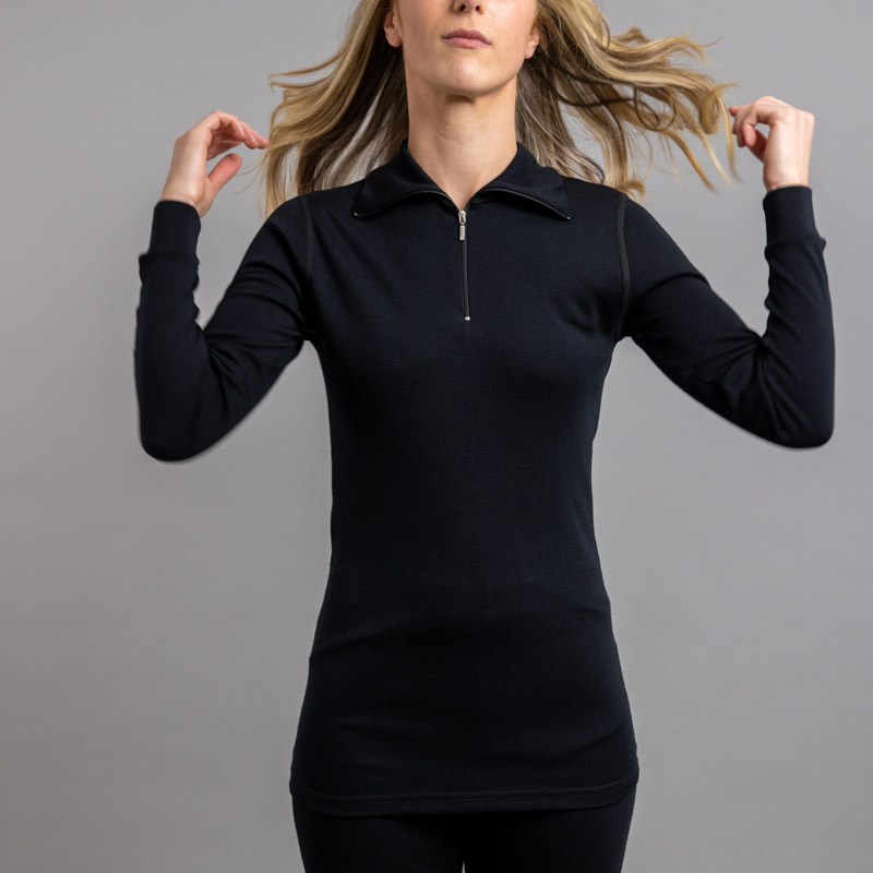 Front of a lady wearing black Merino Skins – Unisex Long Sleeve Half Zip Front
