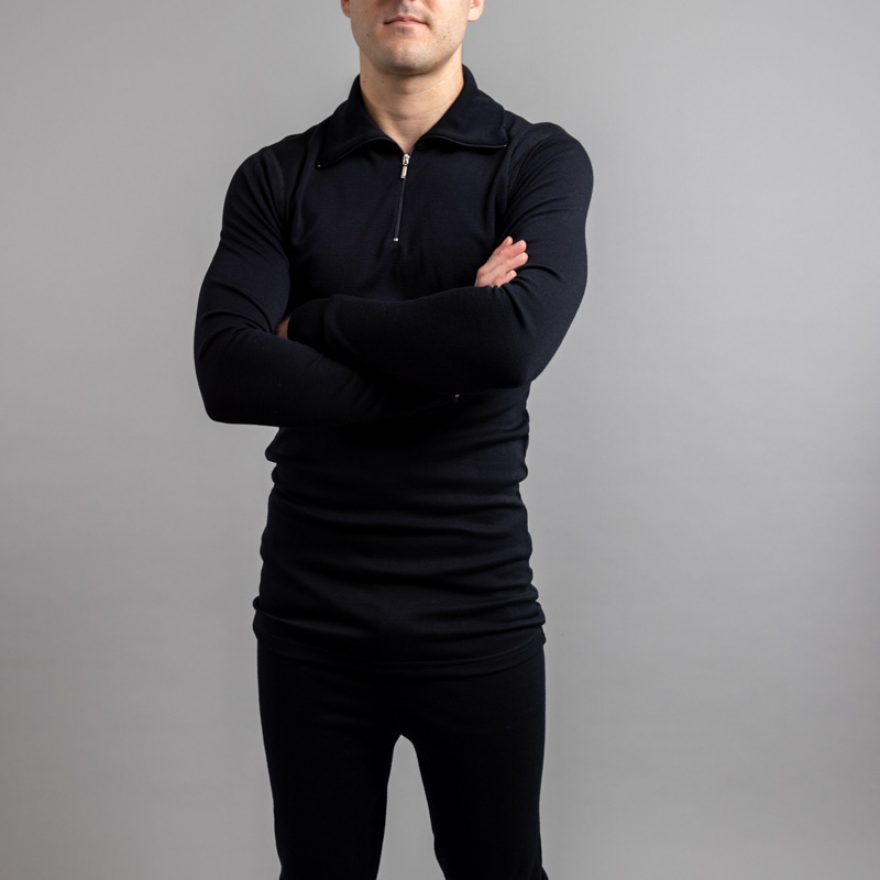 Front view of a male wearing black Merino Skins – Unisex Long Sleeve Half Zip Front