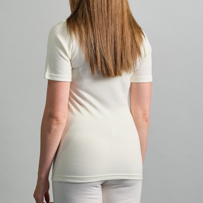back view of a female wearing white Merino Skins – Unisex Short Sleeve Crew Neck