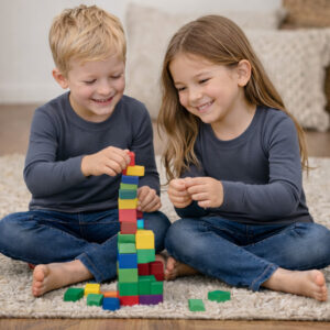a boy and girl wearing grey Ktena MS Lite merino long sleeve tops