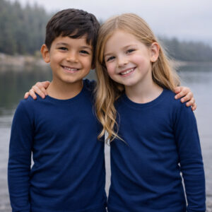 a boy and girl wearing navy Ktena MS Lite merino long sleeve tops